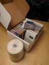 CD storage system: extracted liners, a storage box, CDs on spindle